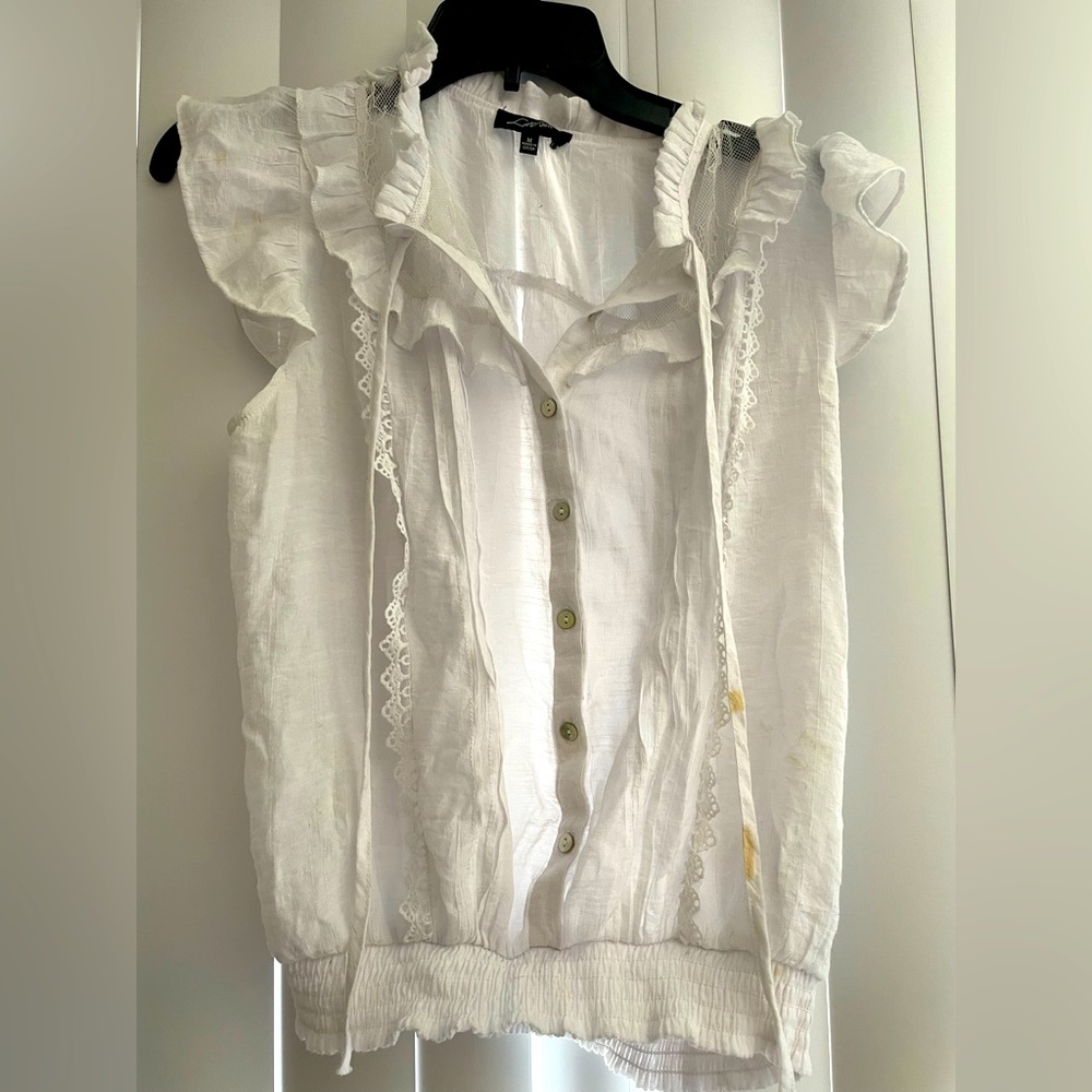 White ruffled shirt by Love Universal. Size medium.